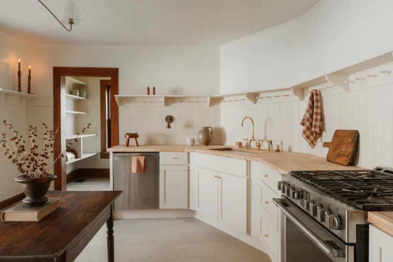 Bright kitchen with white cabinets and wooden countertops