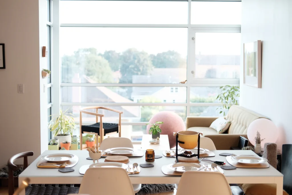 Bright room with a dining table set beside a large window